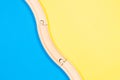 Toys background. Wooden curve railways on colorful background