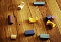 Toys blocks, multicolor wooden building bricks, heap of colorful game pieces on a wood table Royalty Free Stock Photo