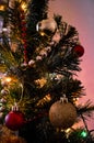 Toys on christmas tree with bright lights