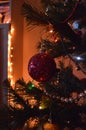 Toys on christmas tree with bright lights