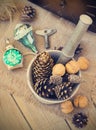 Toys for the Christmas tree and pine cones on old wooden background Royalty Free Stock Photo