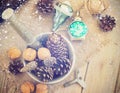 Toys for the Christmas tree and pine cones on old wooden background Royalty Free Stock Photo