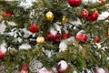 Toys on Christmas tree with snow