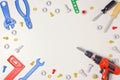 Toys construction tools from kids tool kit frame on white background. Top view. Flat lay. Copy space text Royalty Free Stock Photo
