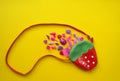 Toys for girls. Flat lay Pink toys on a yellow background. Royalty Free Stock Photo