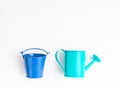 Toys, iron turquoise watering can and blue bucket