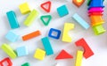 Toys kids background. Wooden cubes with numbers and colorful toy bricks on a white background. frame made of accessories Royalty Free Stock Photo