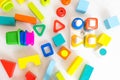 Toys kids background. Wooden cubes with numbers and colorful toy bricks on a white background. frame made of accessories Royalty Free Stock Photo