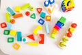 Toys kids background. Wooden cubes with numbers and colorful toy bricks on a white background. frame made of accessories for child Royalty Free Stock Photo