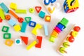 Toys kids background. Wooden cubes with numbers and colorful toy bricks on a white background. frame made of accessories for child Royalty Free Stock Photo