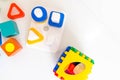 Toys kids background. Wooden cubes with numbers and colorful toy bricks on a white background. frame made of accessories for child Royalty Free Stock Photo