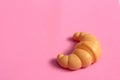 Toys for kids in food theme. One Croissant on isolated background. Food and toy concept. Object made from plastic