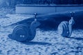 toys of rocking chair in form of snails on modern playground with covering from sand toned in trendy Classic Blue color of the Royalty Free Stock Photo