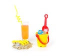 Toys for sand castles and a refreshing drink Royalty Free Stock Photo