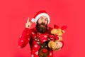 Toys shop. Christmas eve. Gifts for kids. Dear Santa. Bearded man reindeer toy. Plush deer. Hipster man hold Christmas