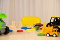 Toys of a small child - wooden blocks for the development of logic and thinking and construction machines, a place for Royalty Free Stock Photo