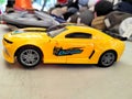 Toys yellow car.speeding deform car