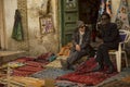 Carpet trade on the street in Tozeur, Tunisia.