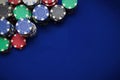 TPoker chips on blue background Royalty Free Stock Photo