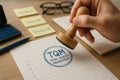 TQM blue approval stamp on quality checklist symbolizing certification and validation of Total Quality Management systems in Royalty Free Stock Photo