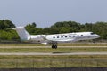 TR-KGM Republic Gabon Gulfstream Aerospace G650-ER aircraft landing on the runway Royalty Free Stock Photo