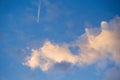 Trace of the airplane in the morning blue sky. Royalty Free Stock Photo