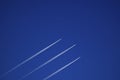 A trace from a jet plane against a blue sky. Background, backdrop or wallpaper. The plane flies very high Royalty Free Stock Photo