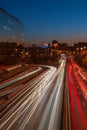 Trace of the lights of cars on a highway at sunset in long exposure in Madrid