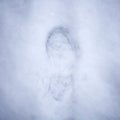 Trace of men`s shoes in the snow