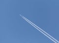 Trace from plane in a blue sky Royalty Free Stock Photo