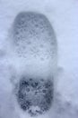 Trace on snow. Fresh snowy shoeprint Royalty Free Stock Photo