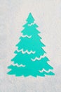 A trace from a stencil in the shape of a Christmas tree made of flour on a blue background. Ideas for festive baking and decoratin Royalty Free Stock Photo