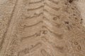 Trace of tractor tire in the sand Royalty Free Stock Photo