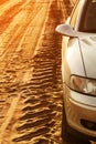 Trace of wheels and car on a road