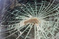 Trace in the windshield from the head of the passenger of the car in an accident or collision with an obstacle. broken glass head Royalty Free Stock Photo