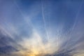 Traces of airplanes on a blue sky at sunset Royalty Free Stock Photo