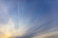 Traces of airplanes on a blue sky at sunset Royalty Free Stock Photo