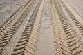 Traces of car tires footprints in the sand Royalty Free Stock Photo