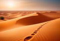 Traces of a caravan and a person on the sand in the hot Sahara, an oasis with palm trees and a lake in the background Royalty Free Stock Photo