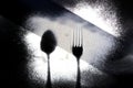Traces of cutlery on a dark background