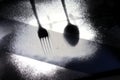 Traces of cutlery on a dark background