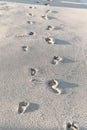 Traces Of Feet On A Sandy Beach In The Summer