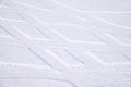 Traces of intersecting arcs of automobile tires in fresh snow