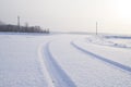 Traces of a lorry on a snow-covered road