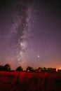 Traces Of Meteors On Night Sky. Natural Real Night Sky Stars With Milky Way Over Field Meadow After Harvest