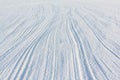 Traces from a parachute cord at snow frozen river Royalty Free Stock Photo