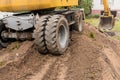 Traces from tire tread on the back of industrial transport excavator or wheel bulldozer