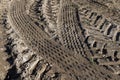 Traces of a tractor or other large machinery on the soil in the field Royalty Free Stock Photo