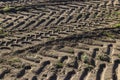 Traces of a tractor or other large machinery on the soil in the field Royalty Free Stock Photo