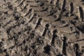 Traces of a tractor or other large machinery on the soil in the field Royalty Free Stock Photo